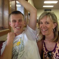 Taylor happy, with Debbie Taylor has Fragile X Syndrome; with mom, Debbie Stevenson