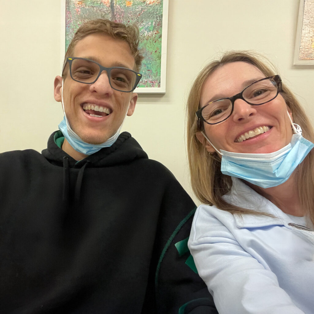 Jason Mazzola and his mother share a moment, illustrating the impact of Fragile X research.