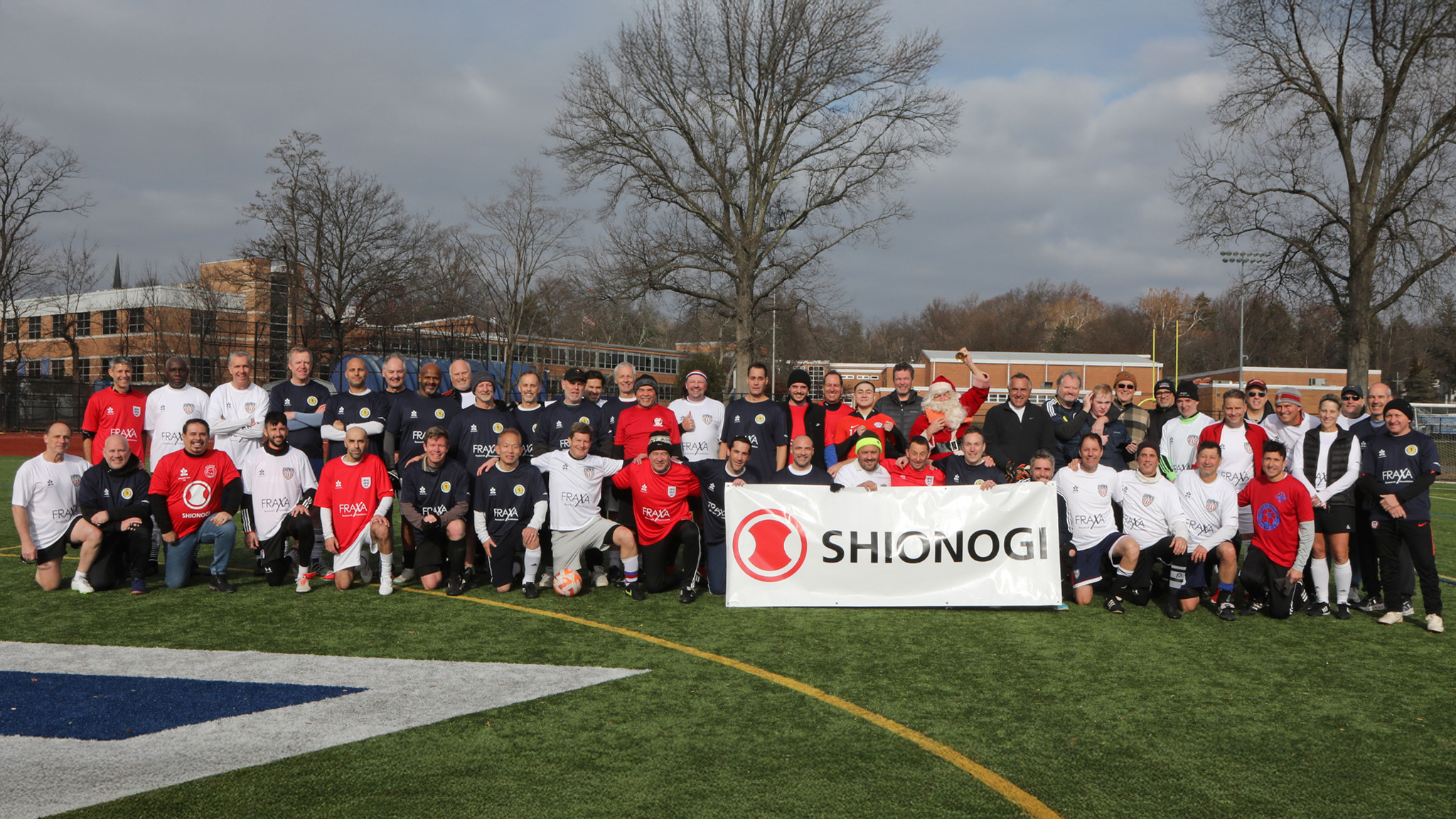 Group photo of Callum Cup IX participants gathered at Millburn High School during the annual charity soccer match supporting Fragile X research.