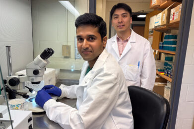 Dr. Anirudh Acharya and Dr. Nien-Pei Tsai study mitochondrial function in a Fragile X syndrome research laboratory.