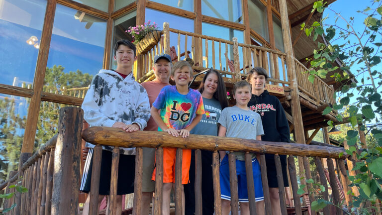 Nicole Mitchell and family gathered outside a lodge