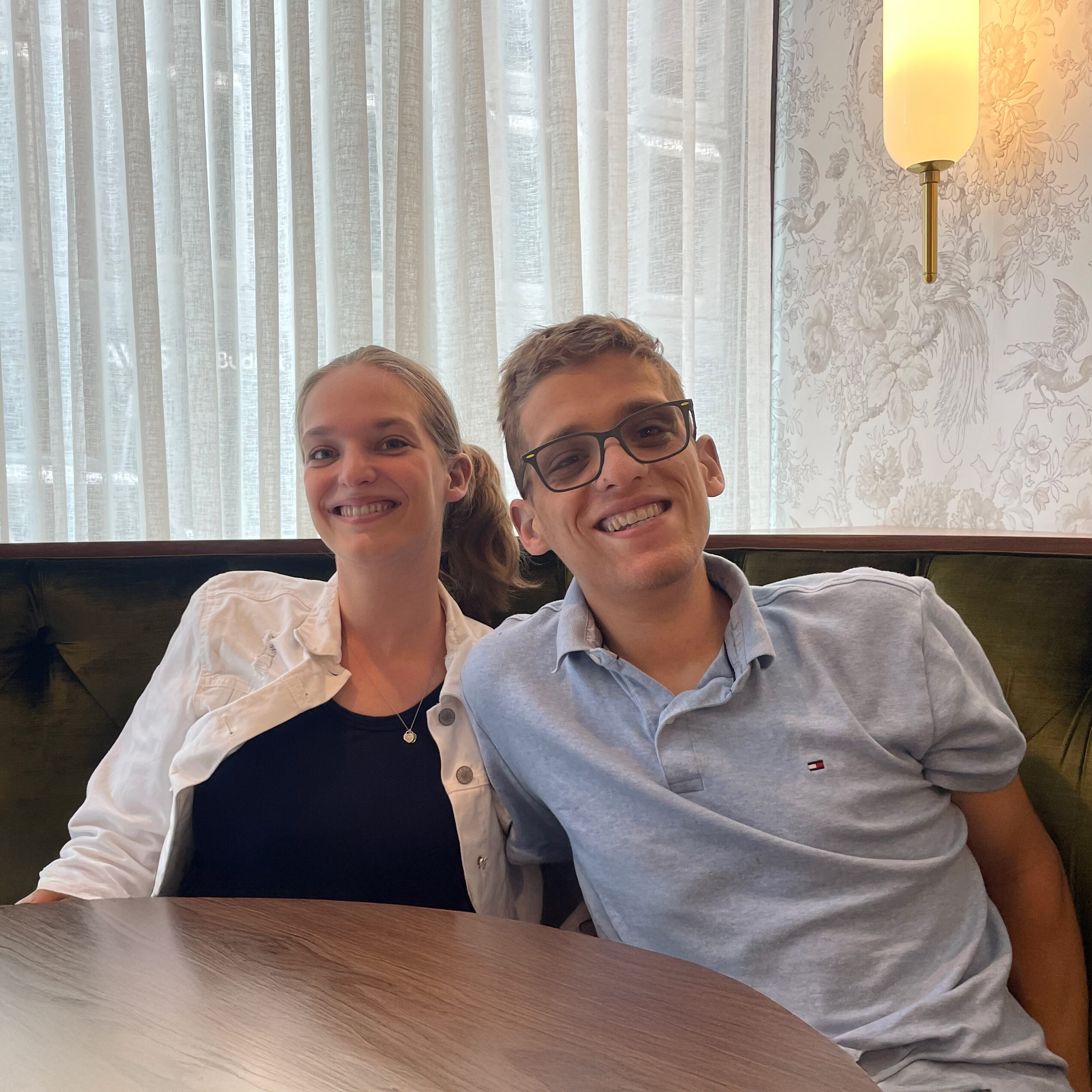 Jason Mazzola and his sister enjoying a meal together, highlighting new levels of independence made possible through Fragile X research.
